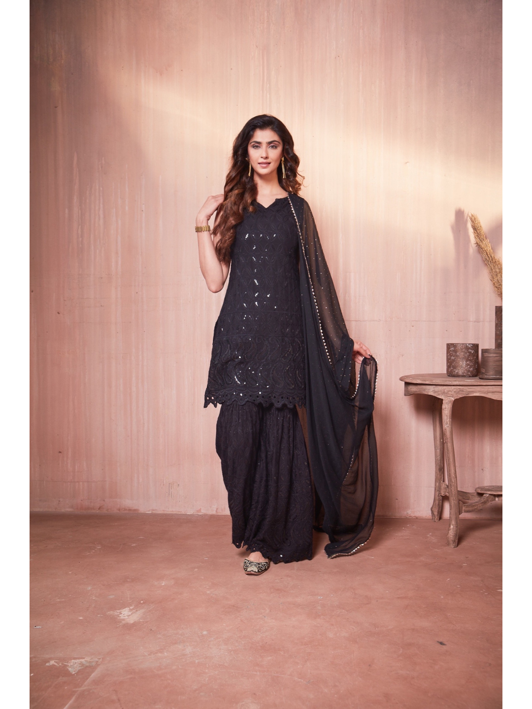 Nikita Sharma's Black Rayon Schiffly chikan Kurti embellished in sequence work with Gharara and Dupatta (3 Piece set) chikan kurti,  chikankari, lucknowi chikan, embroidery kurti, chikan, chikan kurta, lakhnavi kurti, chicken curry kurti, lucknowi chikankari kurti, lucknowi kurti with palazzo, chikan suit, chikankari kurta for women, chikankari kurta, chikankari kurta set, chikankari suit set, gharara, chikankari suits, hand crafted, lucknowi chikankari kurti, lucknowi kurti, lucknowi chikankari
