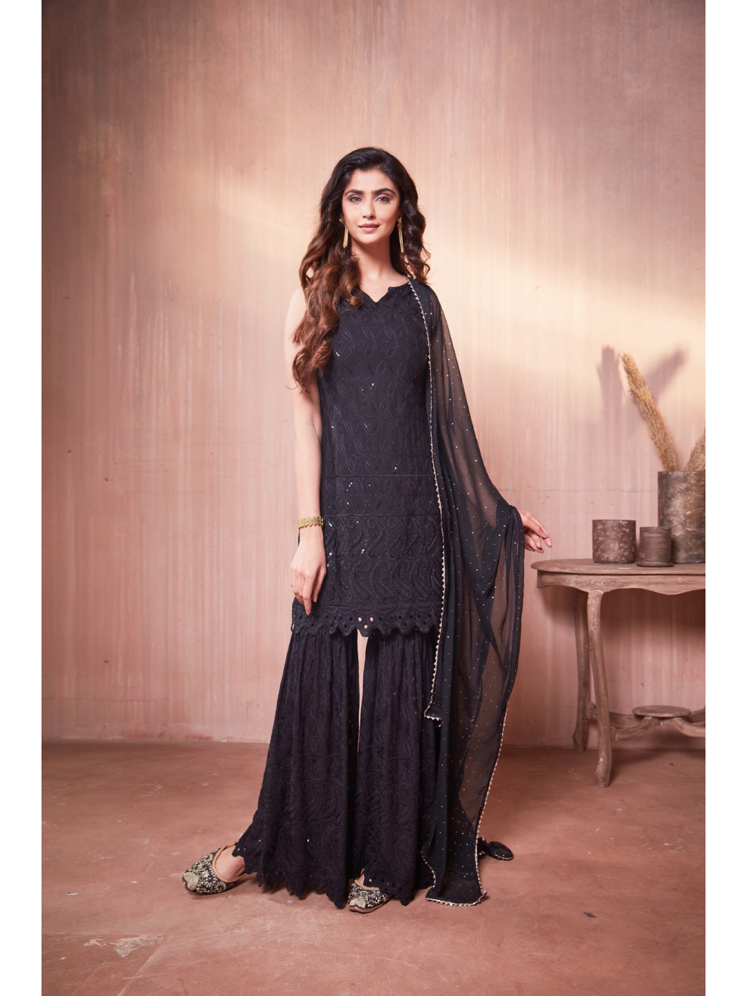 Nikita Sharma's Black Rayon Schiffly chikan Kurti embellished in sequence work with Gharara and Dupatta (3 Piece set) chikan kurti,  chikankari, lucknowi chikan, embroidery kurti, chikan, chikan kurta, lakhnavi kurti, chicken curry kurti, lucknowi chikankari kurti, lucknowi kurti with palazzo, chikan suit, chikankari kurta for women, chikankari kurta, chikankari kurta set, chikankari suit set, gharara, chikankari suits, hand crafted, lucknowi chikankari kurti, lucknowi kurti, lucknowi chikankari