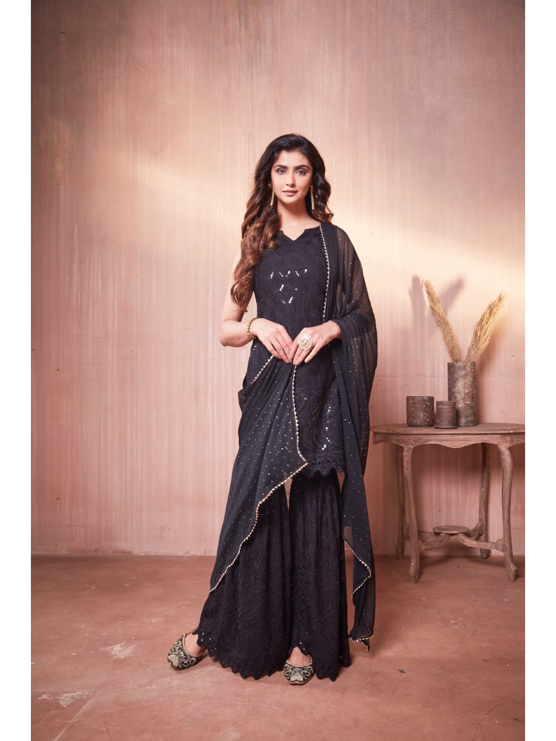 Nikita Sharma's Black Rayon Schiffly chikan Kurti embellished in sequence work with Gharara and Dupatta (3 Piece set) chikan kurti,  chikankari, lucknowi chikan, embroidery kurti, chikan, chikan kurta, lakhnavi kurti, chicken curry kurti, lucknowi chikankari kurti, lucknowi kurti with palazzo, chikan suit, chikankari kurta for women, chikankari kurta, chikankari kurta set, chikankari suit set, gharara, chikankari suits, hand crafted, lucknowi chikankari kurti, lucknowi kurti, lucknowi chikankari