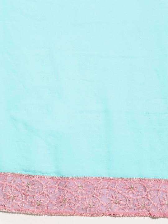 This Saadgi Chikankari Bordered Pink & Blue Viscose Georgette Saree is designed with a machine chikankari border with gold zari work and a contrast lively color. It's perfect for both formal wear and family functions, and comes with an unstitched blouse. Crafted by the renowned Saadgi brand, this saree makes a perfect statement for every occasion. party wear sarees, organza sarees, chicken, chickenkari, chicken saree, lucknowi chikankari saree, saree