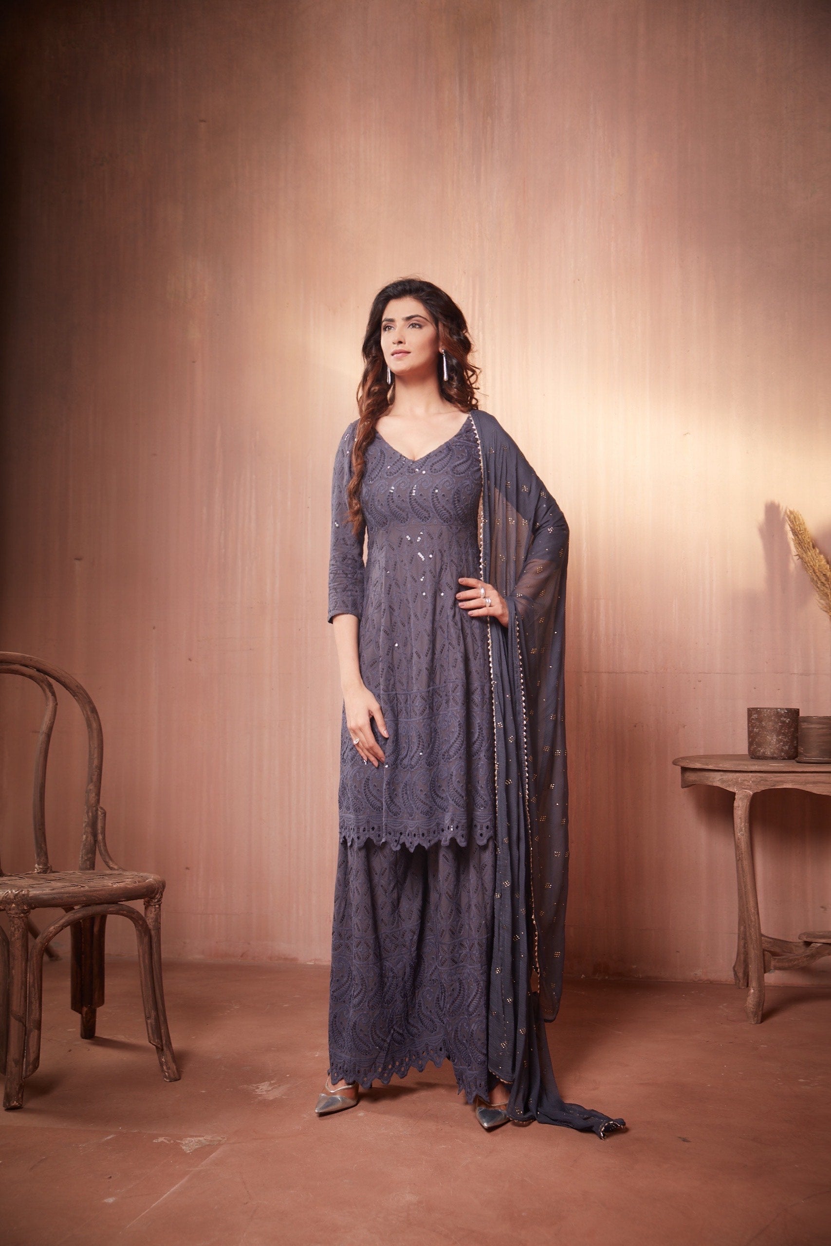 Nikita Sharma's Grey Rayon Schiffly chikan Kurti embellished in sequence work with Gharara and Dupatta (3 Piece set))