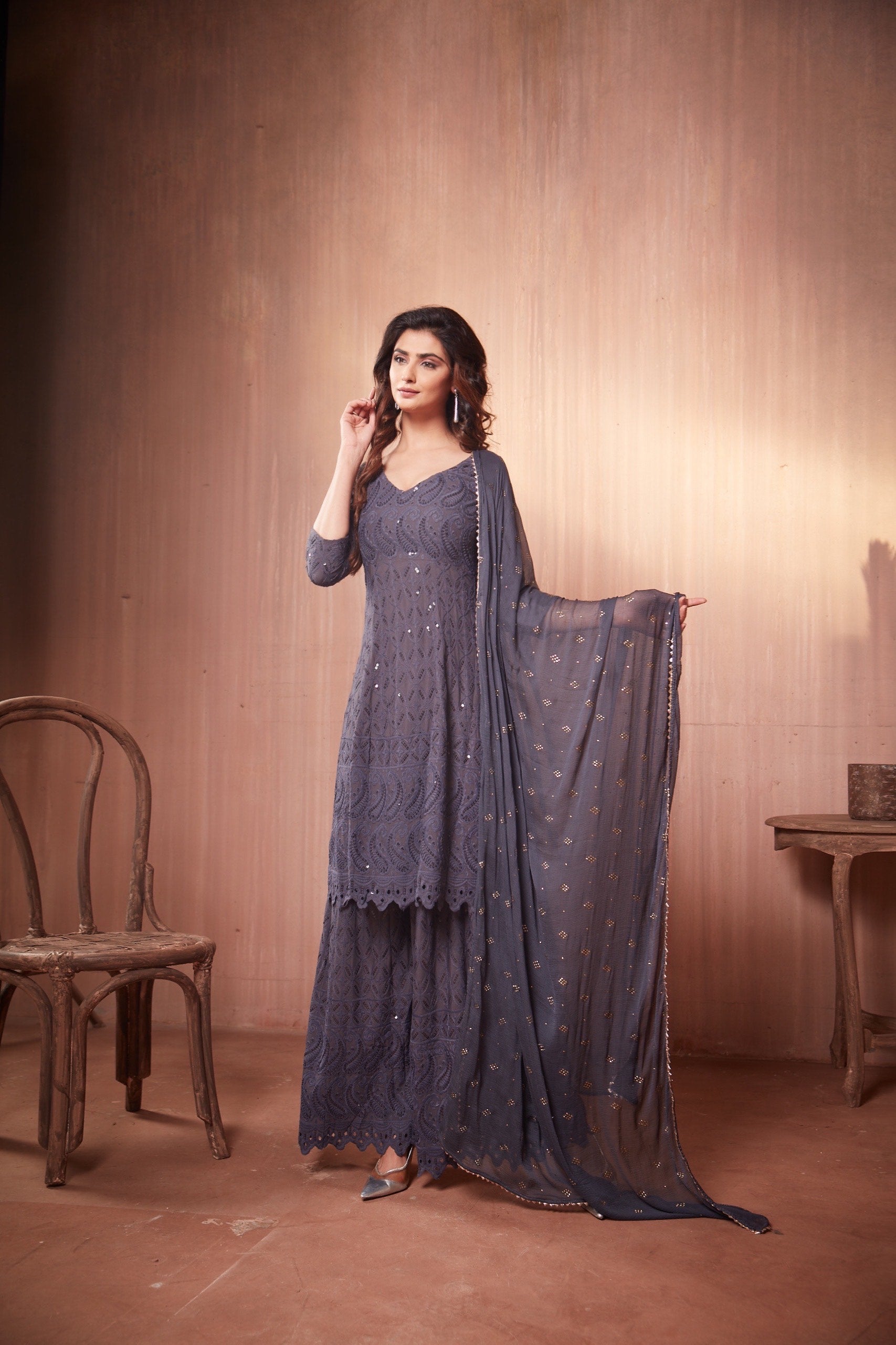 Nikita Sharma's Grey Rayon Schiffly chikan Kurti embellished in sequence work with Gharara and Dupatta (3 Piece set))